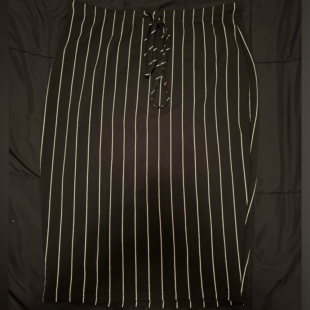 Knee length black skirt with white stripes